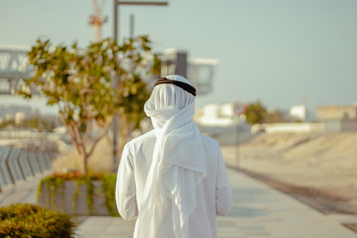 Arab man in white thobe outdoors